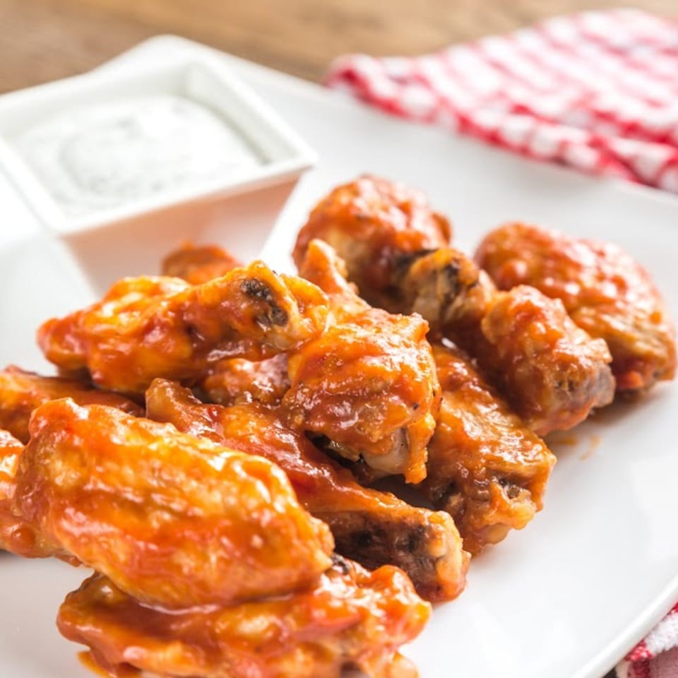 San Francisco Tacos & More's spicy chicken wings with a side of ranch dressing.